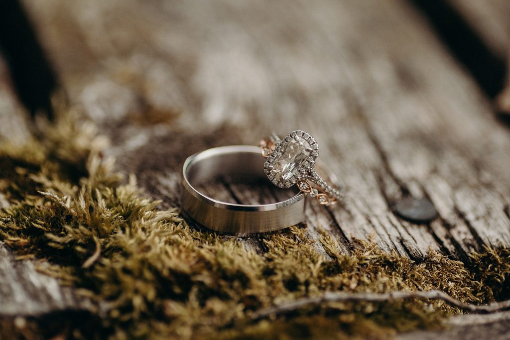 Detail shot of wedding band and engagement ring