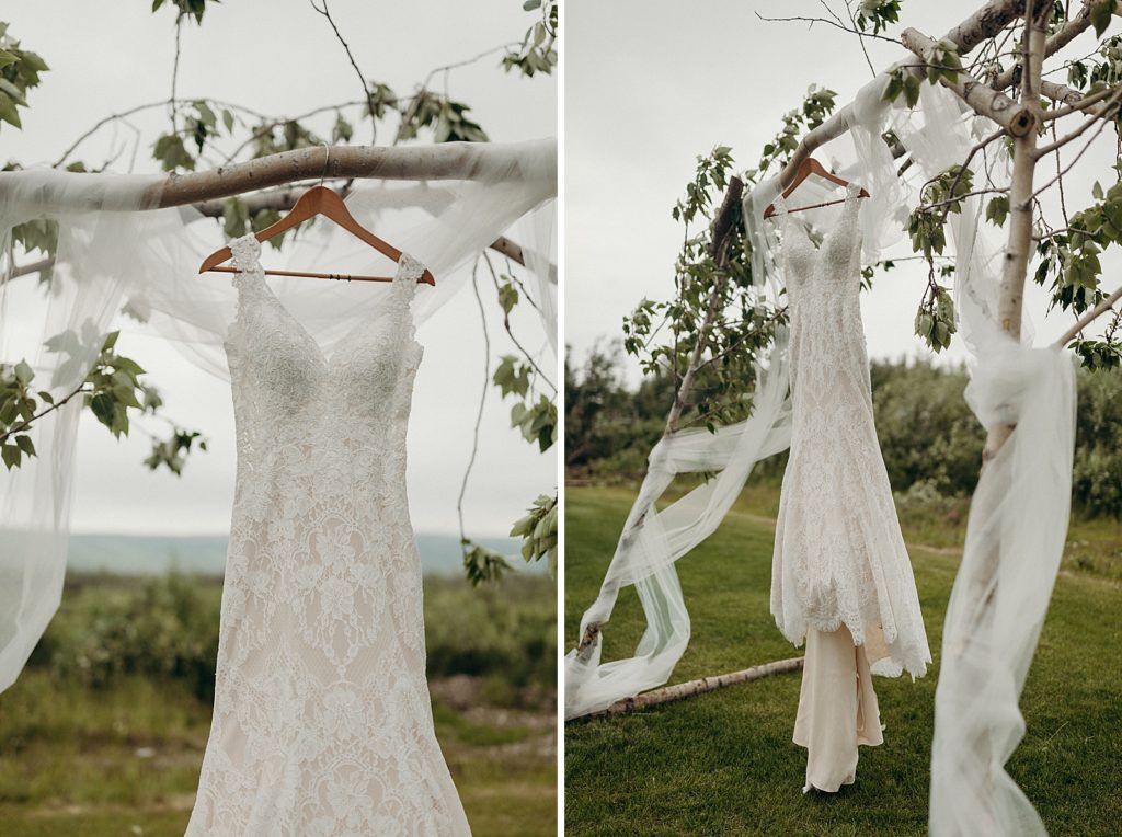 Detail shot of dress on wedding arch