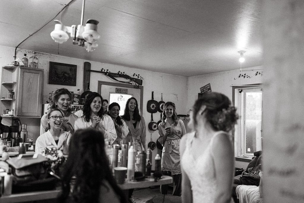 B&W Bridesmaids reaction to seeing Bride in dress