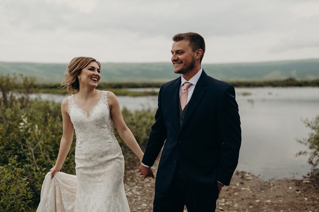 Bride and Groom holding hands and walking together