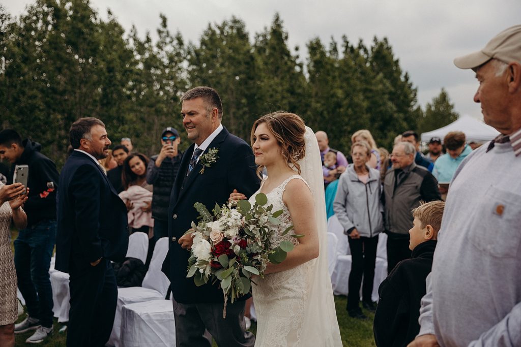 Father and Bride walking down aisle for Ceremony