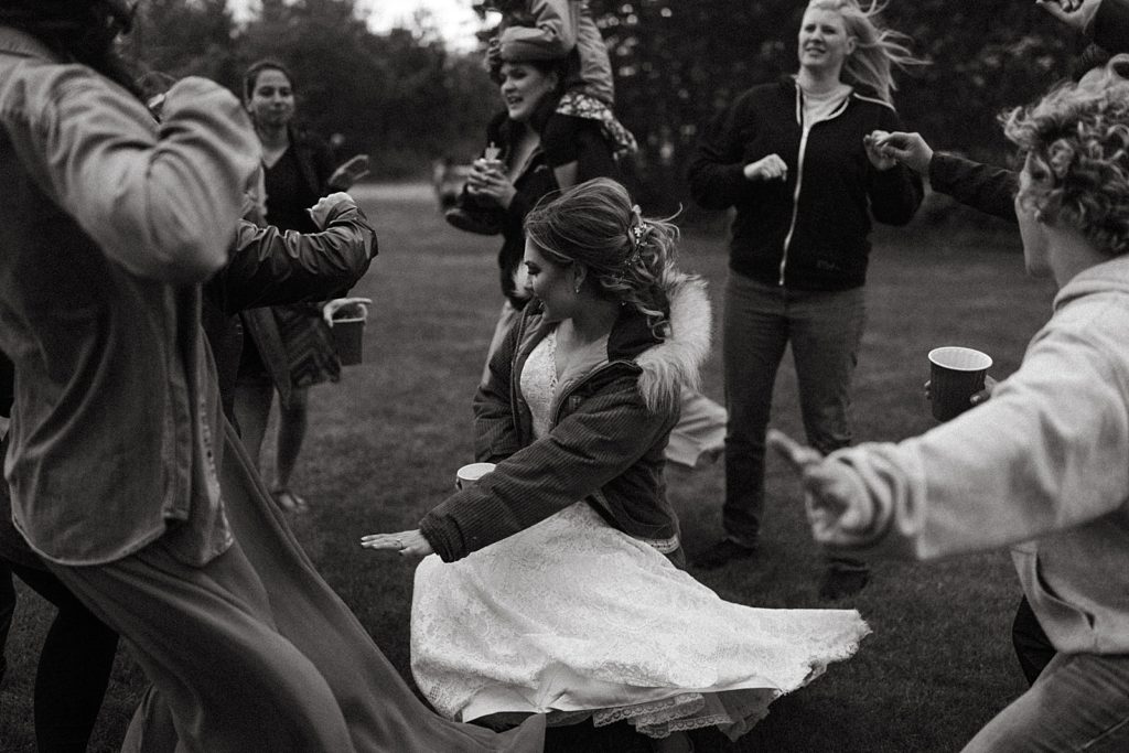 B&W Bride dancing with guests at Reception